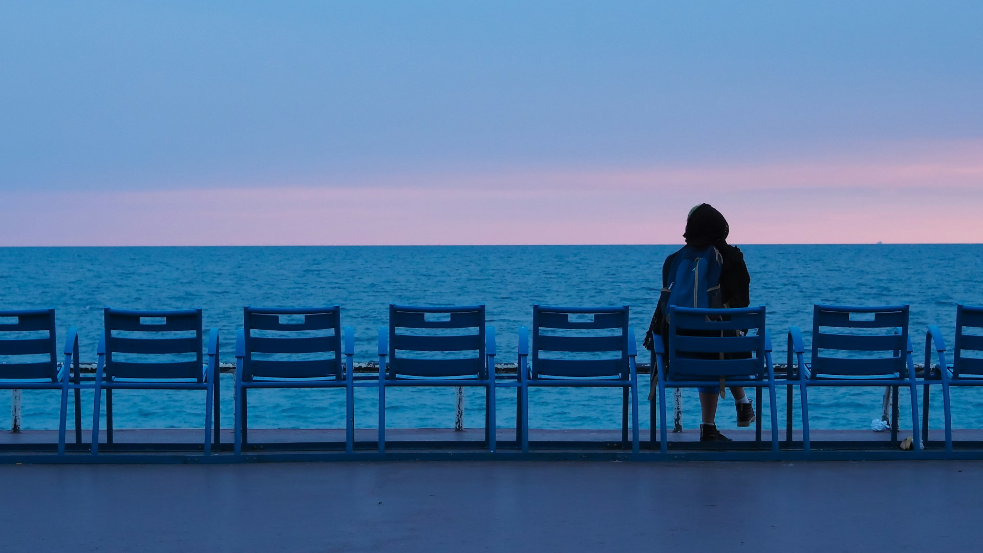 person sitting alone by the sea self talk